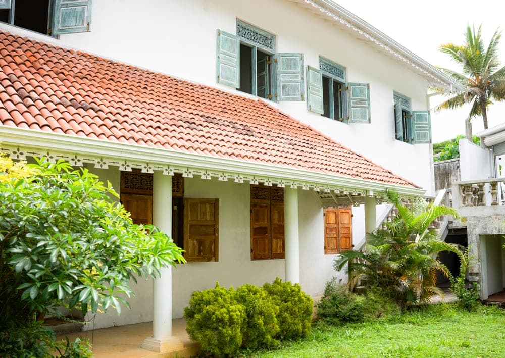 Red-tiled roof and wooden shutters of a heritage home
